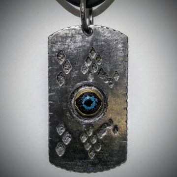 Eye of the Serpent - Stainless steel, enamel, brass, titanium bail